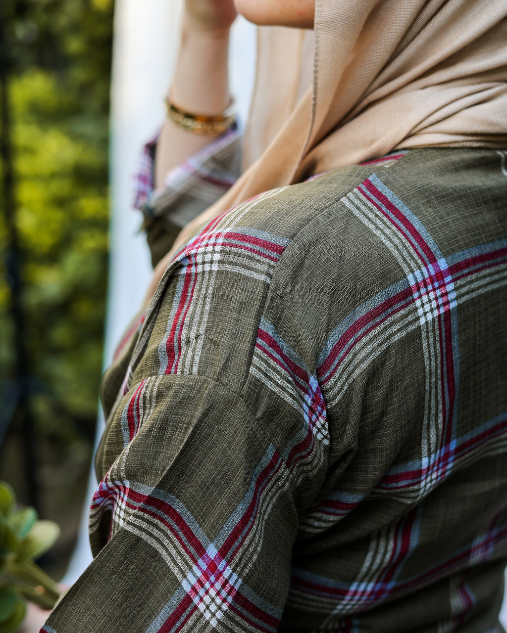 The olive tie shirt